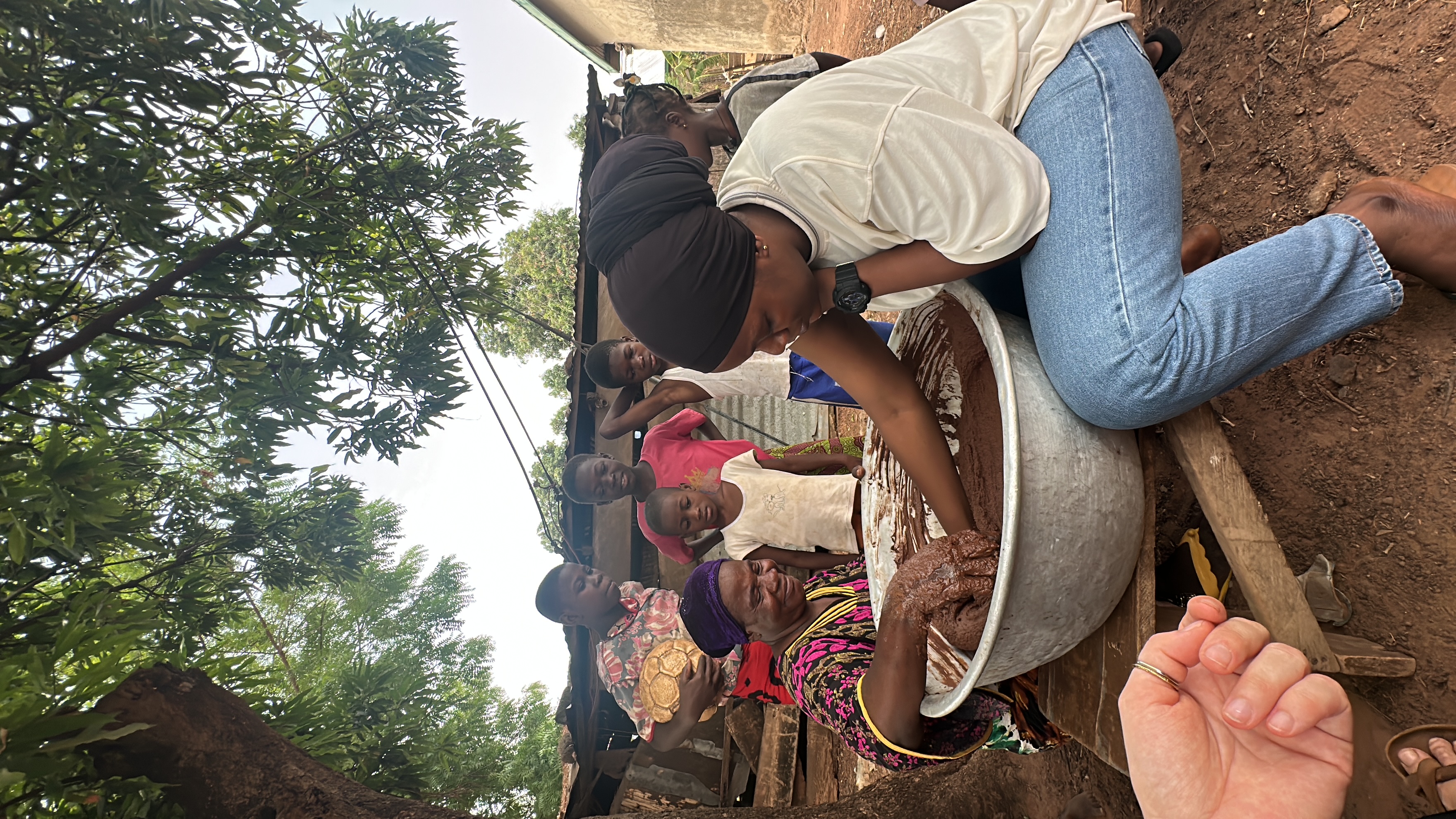 Outdoor shea butter kneading session with the local community, Tamale, Northern Ghana